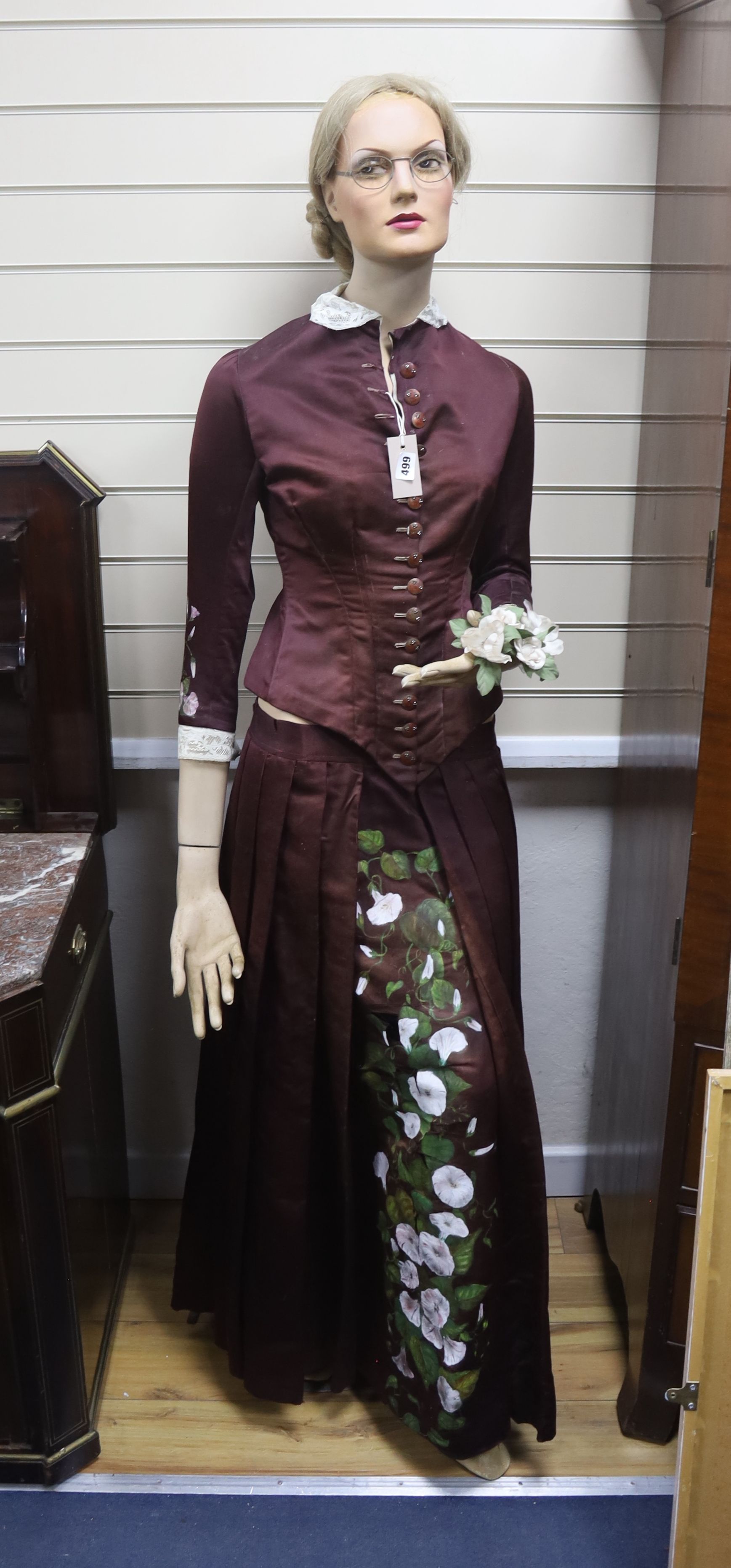 A 1950s full length shop mannequin and a similar together with a Victorian brown silk dress and embroidered coat cape plus clothing,